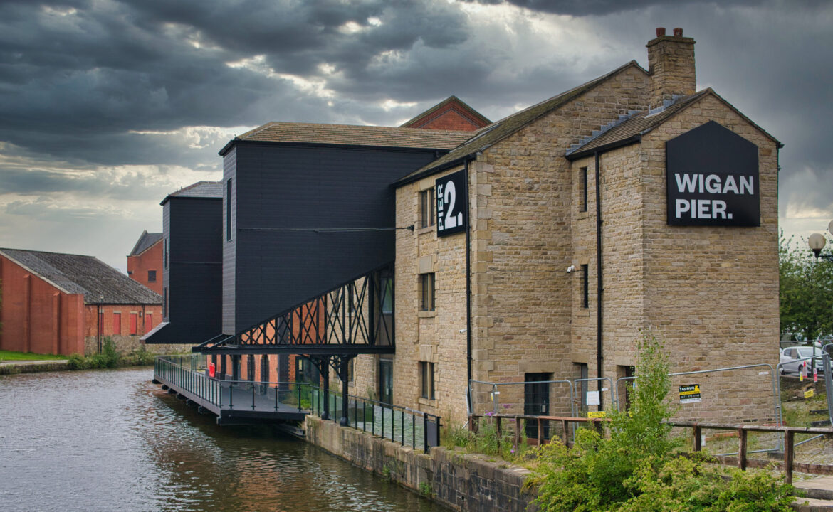Warehouse buildings at Wigan Pier on the Leeds – Liverpool Canal. Now under redevelopment for housing and public access areas including a food hall and event centre.